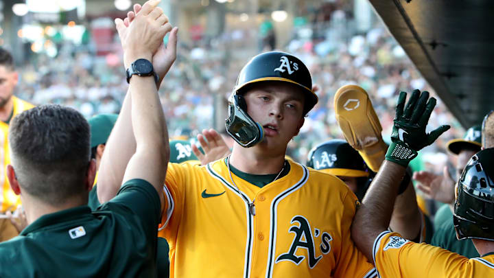 West Sacramento, California, USA; Athletics first baseman Nick Kurtz (16) is congratulated by teammates after scoring a run against the Arizona Diamondbacks during the third inning at Sutter Health Park. West Sacramento, California, USA; Athletics first baseman Nick Kurtz (16) is congratulated by teammates after scoring a run against the Arizona Diamondbacks during the third inning at Sutter Health Park.