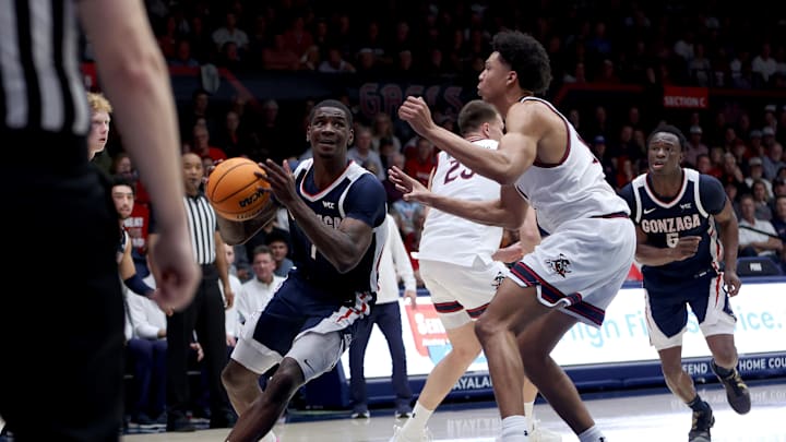 Feb 28, 2026; Moraga, California, USA; Gonzaga Bulldogs guard Tyon Grant-Foster (7) goes up for a shot while being defended by St. Mary's Gaels guard Dillan Shaw (11) during the first half at University Credit Union Pavilion.