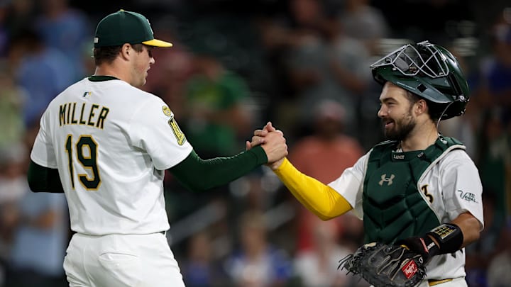 Jul 12, 2025; West Sacramento, California, USA; Athletics pitcher Mason Miller (19) and catcher Shea Langeliers (23) celebrate after defeating the Toronto Blue Jays 4-3 at Sutter Health Park. Mandatory Credit: Dennis Lee-Imagn Images Jul 12, 2025; West Sacramento, California, USA; Athletics pitcher Mason Miller (19) and catcher Shea Langeliers (23) celebrate after defeating the Toronto Blue Jays 4-3 at Sutter Health Park. Mandatory Credit: Dennis Lee-Imagn Images