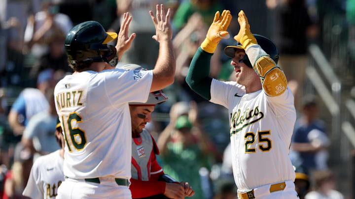 Sep 14, 2025; West Sacramento, California, USA; Athletics right fielder Brent Rooker (25) is congratulated by first baseman Nick Kurtz (16) after hitting a two-run home run against the Cincinnati Reds during the seventh inning at Sutter Health Park. Mandatory Credit: Dennis Lee-Imagn Images