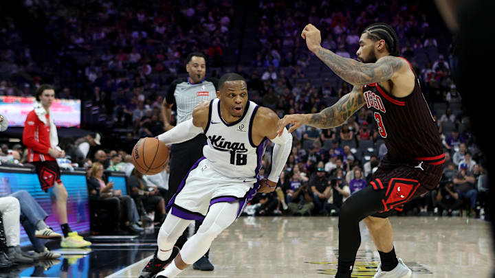 Mar 8, 2026; Sacramento, California, USA; Sacramento Kings guard Russel Westbrook (18) dribbles around Chicago Bulls center Nick Richards (13) during the second quarter at Golden 1 Center. Mandatory Credit: Dennis Lee-Imagn Images