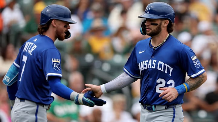 Sep 28, 2025; West Sacramento, California, USA; Kansas City Royals catcher Carter Jensen (22) is congratulated by shortstop Bobby Witt Jr. (7) after scoring a run on a sacrifice fly against the Athletics during the second inning at Sutter Health Park. Mandatory Credit: Dennis Lee-Imagn Images