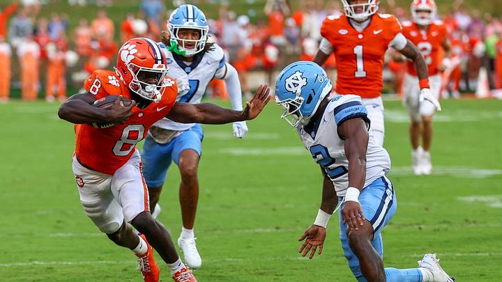Sep 19, 2026; Clemson, South Carolina, USA; Clemson Tigers running back Gideon Davidson (8) runs the ball down field and is pushed out of bounds by University of North Carolina Tar Heels defensive back Caleb Cost (2) at Memorial Stadium. Mandatory Credit: Ashley Tumlin-Imagn Images Sep 19, 2026; Clemson, South Carolina, USA; Clemson Tigers running back Gideon Davidson (8) runs the ball down field and is pushed out of bounds by University of North Carolina Tar Heels defensive back Caleb Cost (2) at Memorial Stadium. Mandatory Credit: Ashley Tumlin-Imagn Images