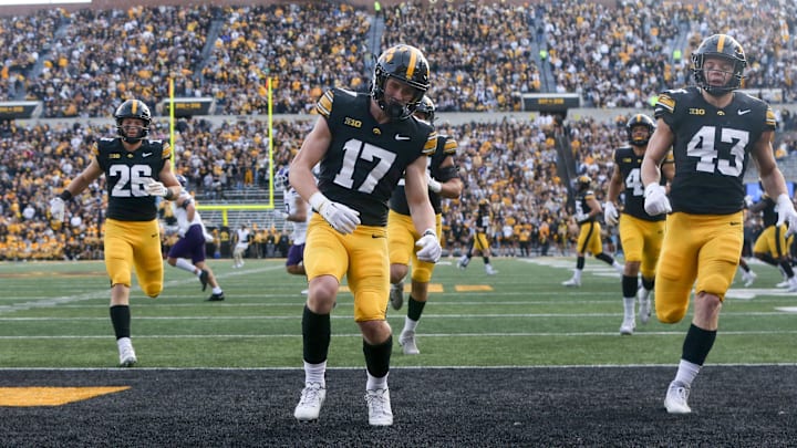 Iowa’s Alex Eichmann (17) and other Hawkeyes race to the ball after a kickoff to Northwestern Saturday, Oct. 26, 2024 at Kinnick Stadium in Iowa City, Iowa.