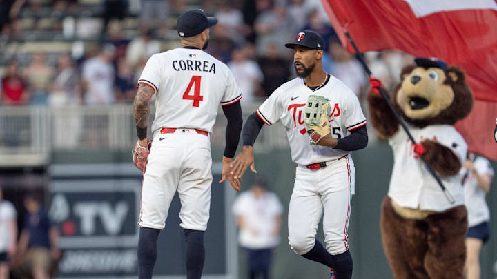May 10, 2025; Minneapolis, Minnesota, USA; Minnesota Twins shortstop Carlos Correa (4) and Minnesota Twins outfielder Byron Buxton (25) celebrate a victory over the San Francisco Giants at Target Field. Mandatory Credit: Matt Blewett-Imagn Images