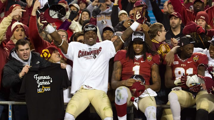 Dec 7, 2013; Charlotte, NC, USA; Florida State Seminoles running back James Wilder Jr. (32) wide receiver Kelvin Benjamin (1) and wide receiver Kenny Shaw (81) celebrate with fans after defeating the Duke Blue Devils at Bank of America Stadium. FSU defeated Duke 45-7. Mandatory Credit: Jeremy Brevard-Imagn Images