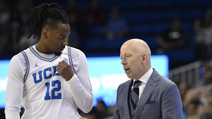 Feb 23, 2025; Los Angeles, California, USA; UCLA Bruins head coach Mick Cronin talks to UCLA Bruins guard Sebastian Mack (12) during the second half at Pauley Pavilion presented by Wescom. Mandatory Credit: Robert Hanashiro-Imagn Images Feb 23, 2025; Los Angeles, California, USA; UCLA Bruins head coach Mick Cronin talks to UCLA Bruins guard Sebastian Mack (12) during the second half at Pauley Pavilion presented by Wescom. Mandatory Credit: Robert Hanashiro-Imagn Images