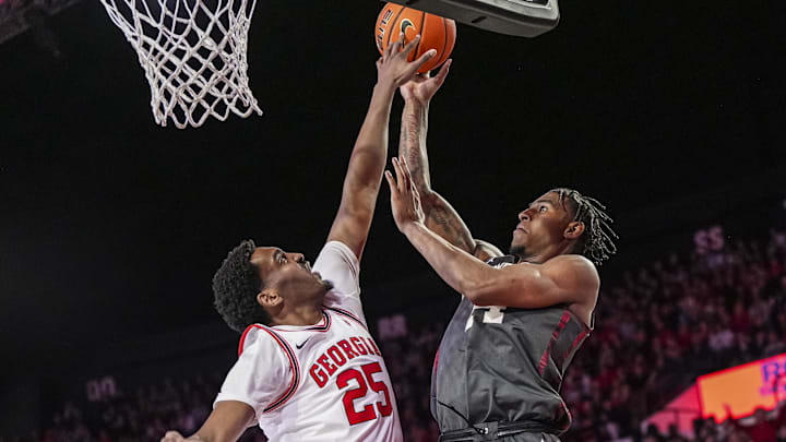 Jan 11, 2025; Athens, Georgia, USA; Oklahoma Sooners forward Jalon Moore (14) shoots over Georgia Bulldogs forward Justin Abson (25) during the second half at Stegeman Coliseum. Mandatory Credit: Dale Zanine-Imagn Images Jan 11, 2025; Athens, Georgia, USA; Oklahoma Sooners forward Jalon Moore (14) shoots over Georgia Bulldogs forward Justin Abson (25) during the second half at Stegeman Coliseum. Mandatory Credit: Dale Zanine-Imagn Images