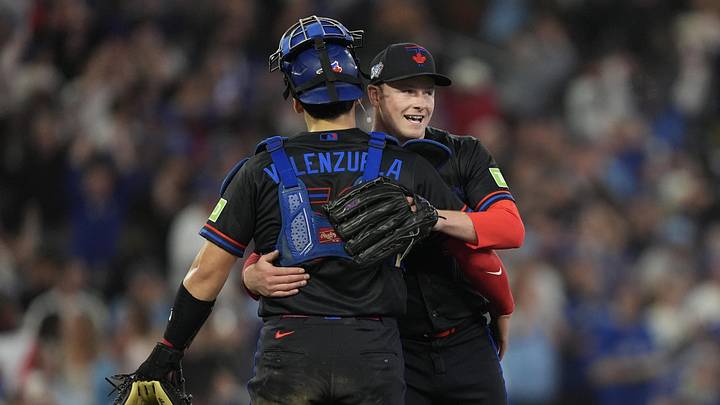 May 22, 2026; Toronto, Ontario, CAN; Toronto Blue Jays pitcher Louis Varland (77) and catcher Brandon Valenzuela (59) celebrate after a win over the Pittsburgh Pirates at Rogers Centre.