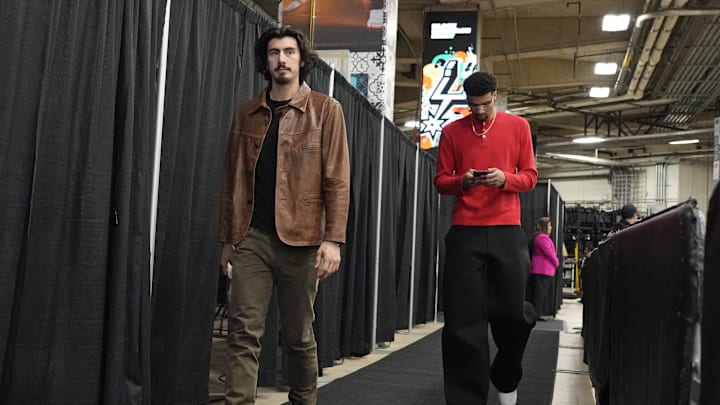 Feb 1, 2025; San Antonio, Texas, USA; Miami Heat forward Jaime Jaquez Jr. (11) and center Kel'el Ware (7) enters Frost Bank Center before a game against the San Antonio Spurs. Mandatory Credit: Scott Wachter-Imagn Images