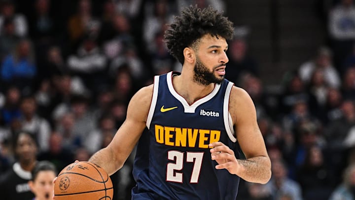 Jan 25, 2025; Minneapolis, Minnesota, USA; Denver Nuggets guard Jamal Murray (27) controls the ball against the Minnesota Timberwolves during the second quarter at Target Center. Mandatory Credit: Jeffrey Becker-Imagn Images