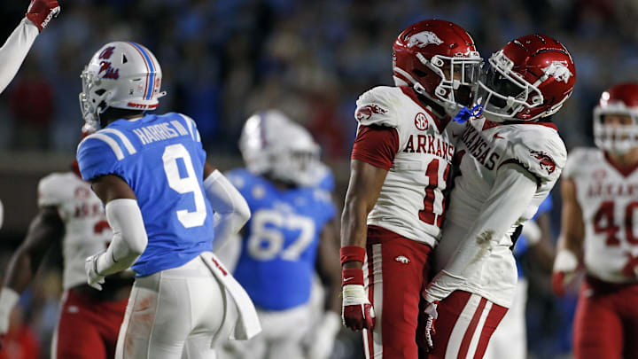 Oct 7, 2023; Oxford, Mississippi, USA; Arkansas Razorbacks defensive backs Jaylon Braxton (11) and Lorando Johnson (1) react after a pass break up during the first half against the Mississippi Rebels at Vaught-Hemingway Stadium. Mandatory Credit: Petre Thomas-Imagn Images Oct 7, 2023; Oxford, Mississippi, USA; Arkansas Razorbacks defensive backs Jaylon Braxton (11) and Lorando Johnson (1) react after a pass break up during the first half against the Mississippi Rebels at Vaught-Hemingway Stadium. Mandatory Credit: Petre Thomas-Imagn Images
