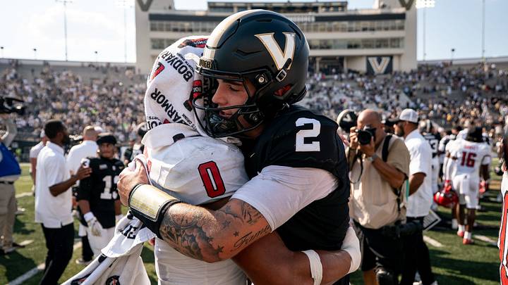 Vanderbilt quarterback Jared Curtis (2) hugs NC State linebacker Popo Aguirre (0) after Vanderbilt won at FirstBank Stadium in Nashville, Tenn., Saturday, Sept. 19, 2026. Vanderbilt quarterback Jared Curtis (2) hugs NC State linebacker Popo Aguirre (0) after Vanderbilt won at FirstBank Stadium in Nashville, Tenn., Saturday, Sept. 19, 2026.