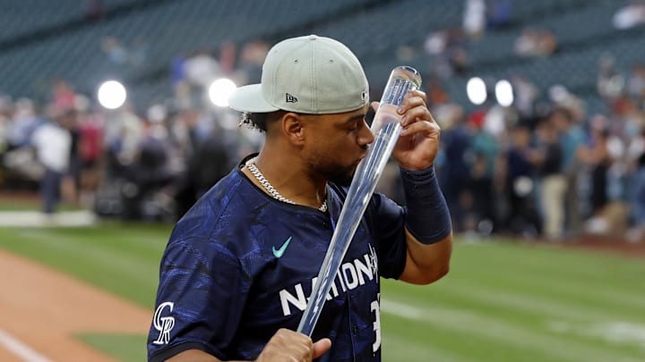 National League catcher Elias DIaz of the Colorado Rockies (35) kisses the MVP trophy after winning the 2023 MLB All Star Game at T-Mobile Park. 