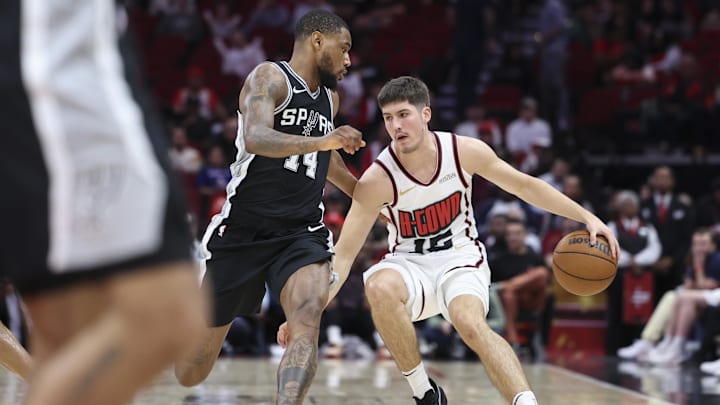 Feb 26, 2025; Houston, Texas, USA; Houston Rockets guard Reed Sheppard (15) dribbles the ball as San Antonio Spurs guard Blake Wesley (14) defends during the fourth quarter at Toyota Center. Mandatory Credit: Troy Taormina-Imagn Images