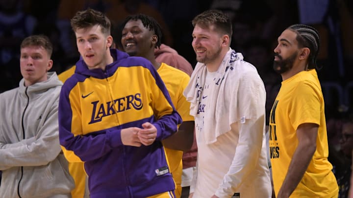 Feb 10, 2025; Los Angeles, California, USA; Los Angeles Lakers guard Dalton Knecht (4), guard Austin Reaves (15) and guard Gabe Vincent (7) on the bench in the second half against the Utah Jazz at Crypto.com Arena. Mandatory Credit: Jayne Kamin-Oncea-Imagn Images
