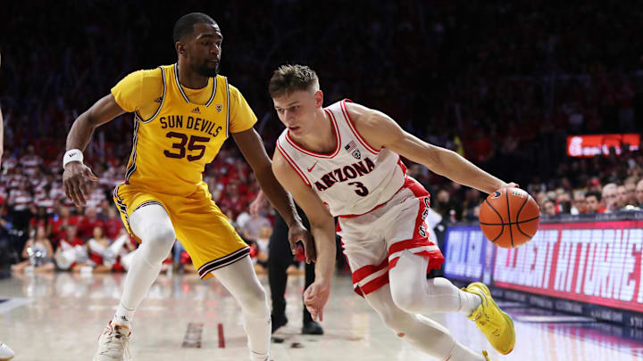 Feb 25, 2023; Tucson, Arizona, USA; Arizona Wildcats guard Pelle Larsson (3) drives to the net against Arizona State Sun Devils guard Devan Cambridge (35) in the second half at McKale Center. Mandatory Credit: Zachary BonDurant-Imagn Images