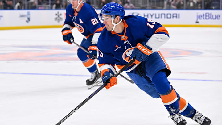 Oct 26, 2024; Elmont, New York, USA; New York Islanders center Mathew Barzal (13) skates with the puck against the Florida Panthers during the second period at UBS Arena. Mandatory Credit: Dennis Schneidler-Imagn Images Oct 26, 2024; Elmont, New York, USA; New York Islanders center Mathew Barzal (13) skates with the puck against the Florida Panthers during the second period at UBS Arena. Mandatory Credit: Dennis Schneidler-Imagn Images