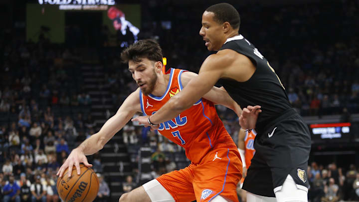 Mar 16, 2024; Memphis, Tennessee, USA; Oklahoma City Thunder forward Chet Holmgren (7) drives to the basket as Memphis Grizzlies guard Desmond Bane (22) defends during the first half at FedExForum. Mandatory Credit: Petre Thomas-Imagn Images