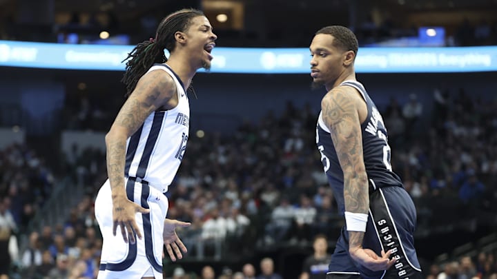 Dec 3, 2024; Dallas, Texas, USA;  Memphis Grizzlies guard Ja Morant (12) reacts in front of Dallas Mavericks forward P.J. Washington (25) during the second half at American Airlines Center. Mandatory Credit: Kevin Jairaj-Imagn Images