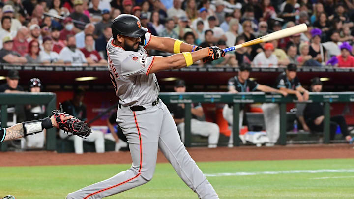 Sep 23, 2024; Phoenix, Arizona, USA;  San Francisco Giants outfielder Jerar Encarnacion (59) hits a RBI double in the third inning against the Arizona Diamondbacks at Chase Field. Mandatory Credit: Matt Kartozian-Imagn Images