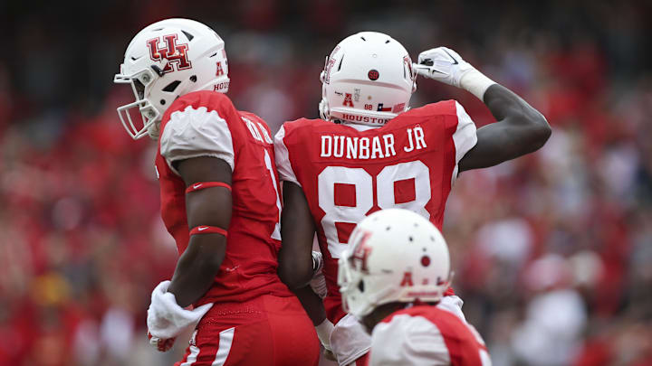 Nov 27, 2015; Houston, TX, USA; Houston Cougars quarterback Greg Ward Jr. (1) and wide receiver Steven Dunbar (88) celebrate after a touchdown score during the first quarter against the Navy Midshipmen at TDECU Stadium. Mandatory Credit: Troy Taormina-Imagn Images Nov 27, 2015; Houston, TX, USA; Houston Cougars quarterback Greg Ward Jr. (1) and wide receiver Steven Dunbar (88) celebrate after a touchdown score during the first quarter against the Navy Midshipmen at TDECU Stadium. Mandatory Credit: Troy Taormina-Imagn Images