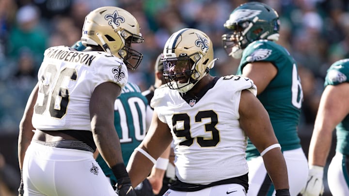 Jan 1, 2023; Philadelphia, Pennsylvania, USA; New Orleans Saints defensive tackle David Onyemata (93) and defensive end Carl Granderson (96) celebrate a sack against the Philadelphia Eagles during the second quarter at Lincoln Financial Field. Mandatory Credit: Bill Streicher-Imagn Images Jan 1, 2023; Philadelphia, Pennsylvania, USA; New Orleans Saints defensive tackle David Onyemata (93) and defensive end Carl Granderson (96) celebrate a sack against the Philadelphia Eagles during the second quarter at Lincoln Financial Field. Mandatory Credit: Bill Streicher-Imagn Images