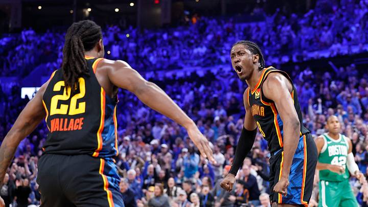 Jan 5, 2025; Oklahoma City, Oklahoma, USA; Oklahoma City Thunder guard Cason Wallace (22) and Oklahoma City Thunder forward Jalen Williams (8) celebrate after Cason scores against the Boston Celtics during the fourth quarter at Paycom Center. Mandatory Credit: Alonzo Adams-Imagn Images