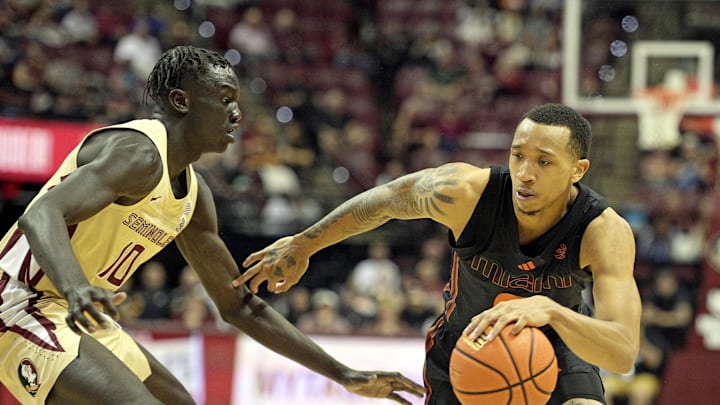 Mar 9, 2024; Tallahassee, Florida, USA; Miami Hurricanes guard Matthew Cleveland (right) drives to