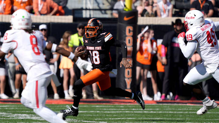 Oklahoma State Cowboys quarterback Sam Jackson V (18) runs during a college football game between the Oklahoma State Cowboys (OSU) and the Houston Cougars at Boone Pickens Stadium in Stillwater, Okla., Saturday, Oct. 11, 2025. Oklahoma State Cowboys quarterback Sam Jackson V (18) runs during a college football game between the Oklahoma State Cowboys (OSU) and the Houston Cougars at Boone Pickens Stadium in Stillwater, Okla., Saturday, Oct. 11, 2025.