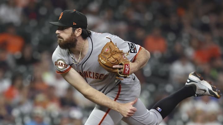 Apr 1, 2025; Houston, Texas, USA; San Francisco Giants relief pitcher Ryan Walker (74) delivers a pitch during the ninth inning against the Houston Astros at Daikin Park. / Troy Taormina-Imagn Images