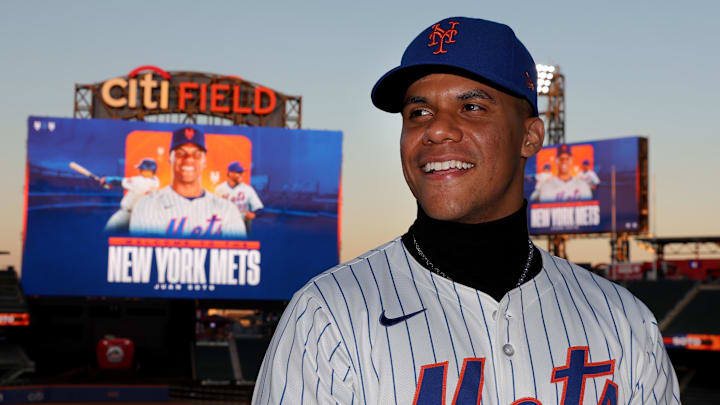 Dec 12, 2024; Flushing, NY, USA; New York Mets right fielder Juan Soto poses for photos during his introductory press conference at Citi Field. Mandatory Credit: Brad Penner-Imagn Images