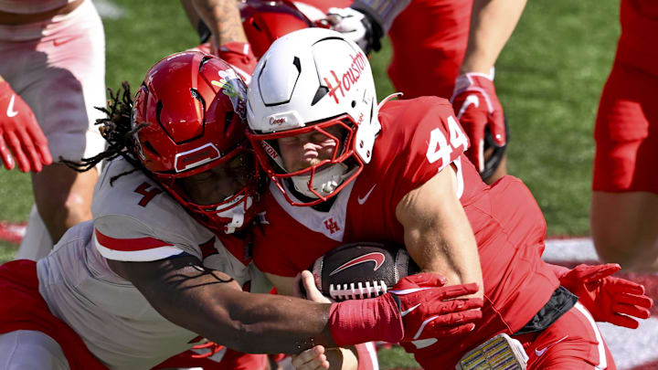 Oct 18, 2025; Houston, Texas, USA; Arizona Wildcats linebacker Max Harris (4) tackles Houston Cougars running back Dean Connors (44) during the first quarter at TDECU Stadium. Mandatory Credit: Maria Lysaker-Imagn Images Oct 18, 2025; Houston, Texas, USA; Arizona Wildcats linebacker Max Harris (4) tackles Houston Cougars running back Dean Connors (44) during the first quarter at TDECU Stadium. Mandatory Credit: Maria Lysaker-Imagn Images