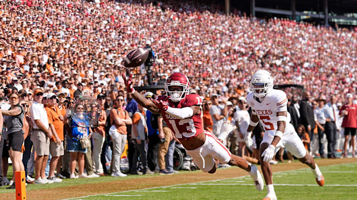 Oklahoma Sooners wide receiver J.J. Hester (13) can not make a catch as Texas Longhorns defensive back Malik Muhammad (5) defends in the first half of the Red River Rivalry college football game between the University of Oklahoma Sooners and the Texas Longhorn at the Cotton Bowl Stadium in Dallas, Texas, Saturday, Oct., 12, 2024. Oklahoma Sooners wide receiver J.J. Hester (13) can not make a catch as Texas Longhorns defensive back Malik Muhammad (5) defends in the first half of the Red River Rivalry college football game between the University of Oklahoma Sooners and the Texas Longhorn at the Cotton Bowl Stadium in Dallas, Texas, Saturday, Oct., 12, 2024.