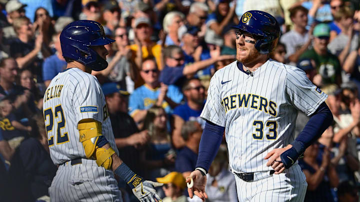 Sep 28, 2025; Milwaukee, Wisconsin, USA; Milwaukee Brewers catcher Danny Jansen (33) is greeted by  designated hitter Christian Yelich (22) after hitting a 2-run homer in the fourth inning against the Cincinnati Reds at American Family Field. Mandatory Credit: Benny Sieu-Imagn Images