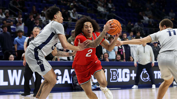 Feb 18, 2026; University Park, Pennsylvania, USA; Rutgers Scarlet Knights guard Lino Mark (2) drives the ball towards the basket as Penn State Nittany Lions guard Freddie Dilione V (5) defends during the second half at Bryce Jordan Center. Mandatory Credit: Matthew O'Haren-Imagn Images