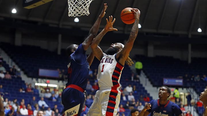 Nov 12, 2024; Oxford, Mississippi, USA; Mississippi Rebels forward Mikeal Brown-Jones (1) shoots as South Alabama Jaguars guard/forward Randy Brady (34) defends during the second half at C.M. 'Tad' Smith Coliseum. Mandatory Credit: Petre Thomas-Imagn Images Nov 12, 2024; Oxford, Mississippi, USA; Mississippi Rebels forward Mikeal Brown-Jones (1) shoots as South Alabama Jaguars guard/forward Randy Brady (34) defends during the second half at C.M. 'Tad' Smith Coliseum. Mandatory Credit: Petre Thomas-Imagn Images