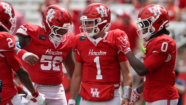Sep 5, 2026; Houston, Texas, USA; Houston Cougars quarterback Conner Weigman (1) reacts with offensive lineman Anthony Boswell (52) and wide receiver Amare Thomas (0) after a play during the fourth quarter against the Oregon State Beavers at TDECU Stadium. Mandatory Credit: Troy Taormina-Imagn Images