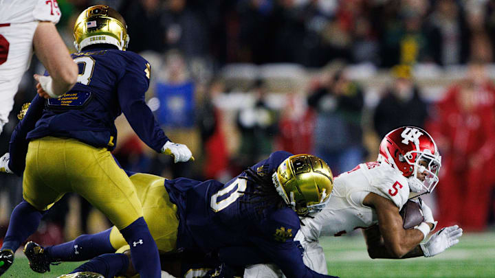 Indiana wide receiver Ke'Shawn Williams (5) is brought down by Notre Dame during the first round of the College Football Playoff between Notre Dame and Indiana on Friday, Dec. 20, 2024, in South Bend.
