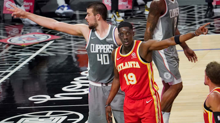  LA Clippers center Ivica Zubac (40) and Atlanta Hawks forward Tony Snell (19) have a difference of opinion on who gets possession of the ball during the second quarter at Staples Center.