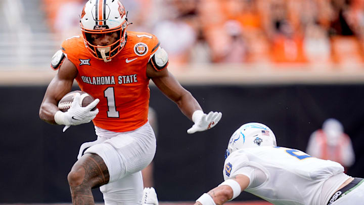 Oklahoma State's De'Zhaun Stribling (1) gets by South Dakota State's Myles Taylor (2) after a reception in the second half of the college football game between the Oklahoma State Cowboys and South Dakota State Jackrabbits at Boone Pickens Stadium in Stillwater, Okla., Saturday, Aug., 31, 2024.