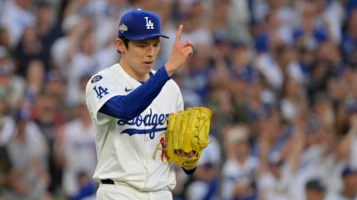 Oct 9, 2025; Los Angeles, California, USA; Los Angeles Dodgers pitcher Roki Sasaki (11) reacts after the tenth inning against the Philadelphia Phillies during game four of the NLDS round for the 2025 MLB playoffs at Dodger Stadium. Mandatory Credit: Jayne Kamin-Oncea-Imagn Images