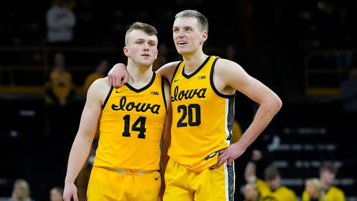 Iowa Hawkeyes guard Carter Kingsbury (14) and Iowa Hawkeyes forward Payton Sandfort (20) stand together as free throws are shot against the Washington Huskies Saturday, Feb. 22, 2025 at Carver-Hawkeye Arenain Iowa City, Iowa. Iowa Hawkeyes guard Carter Kingsbury (14) and Iowa Hawkeyes forward Payton Sandfort (20) stand together as free throws are shot against the Washington Huskies Saturday, Feb. 22, 2025 at Carver-Hawkeye Arenain Iowa City, Iowa.