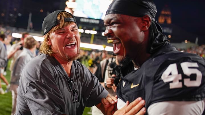 Comedian Theo Von celebrates with Vanderbilt tight end Emmanuel Adebi (45) after the game at FirstBank Stadium in Nashville, Tenn., Saturday, Nov. 8, 2025.
