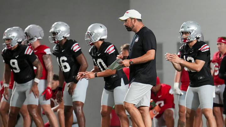 Ohio State Buckeyes head coach Ryan Day watches his quarterbacks throw during football training camp inside the Woody Hayes Athletic Center in Columbus on Aug. 7, 2026. Ohio State Buckeyes head coach Ryan Day watches his quarterbacks throw during football training camp inside the Woody Hayes Athletic Center in Columbus on Aug. 7, 2026.