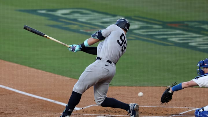 Oct 26, 2024; Los Angeles, California, USA;New York Yankees outfielder Aaron Judge (99) strikes out against the Los Angeles Dodgers in the first inning for game two of the 2024 MLB World Series at Dodger Stadium. Mandatory Credit: Kiyoshi Mio-Imagn Images