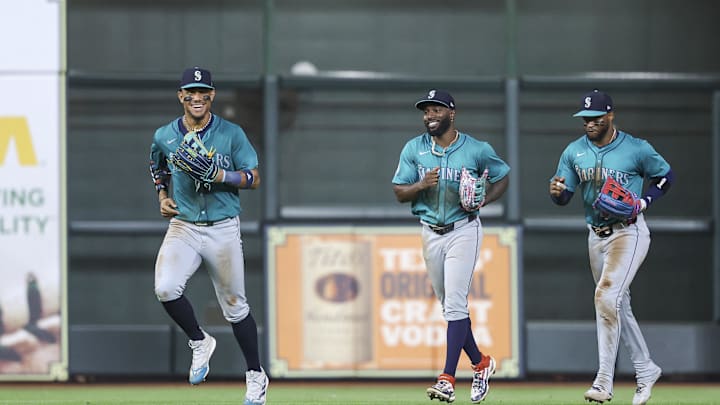 Seattle Mariners center fielder Julio Rodriguez (44) jogs off the field with left fielder Randy Arozarena (56) and right fielder Victor Robles (10) after the game against the Houston Astros at Minute Maid Park on Sept 23.