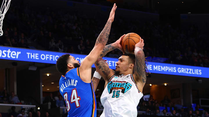 Feb 8, 2025; Memphis, Tennessee, USA; Memphis Grizzlies forward Brandon Clarke (15) drives to the basket as Oklahoma City Thunder forward Kenrich Williams (34) defends during the third quarter at FedExForum. Mandatory Credit: Petre Thomas-Imagn Images