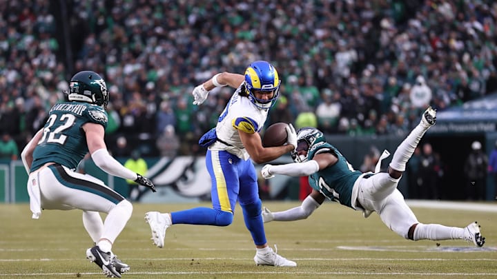 Jan 19, 2025; Philadelphia, Pennsylvania, USA; Los Angeles Rams wide receiver Puka Nacua (17) intercepts a pass in front of Philadelphia Eagles safety Reed Blankenship (32) and Eagles cornerback Quinyon Mitchell (27) during the first half in a 2025 NFC divisional round game at Lincoln Financial Field. Mandatory Credit: Bill Streicher-Imagn Images