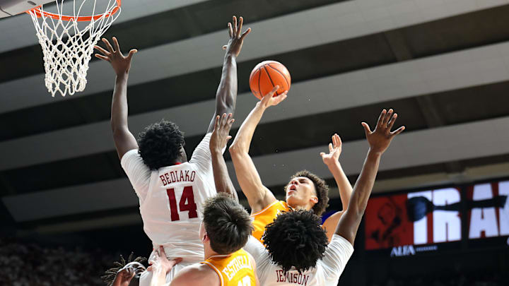 Jan 24, 2026; Tuscaloosa, Alabama, USA; Tennessee Volunteers forward Nate Ament (10) shoots over Alabama Crimson Tide center Charles Bediako (14) during the first half at Coleman Coliseum. Mandatory Credit: David Leong-Imagn Images